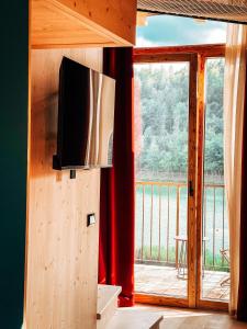 TV a/nebo společenská místnost v ubytování Bazzario Loft