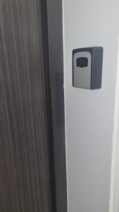 a white refrigerator with a door with a drawer at Apartman Savic 1 in Bijeljina +9 photos