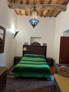 Letto o letti in una camera di Riad Le Lieu