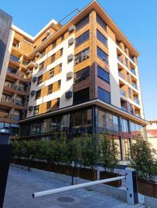 a large apartment building with a large building at Apartman Rentals Lux KG 2 in Kragujevac