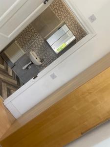 an overhead view of a bathroom with a toilet at Cranley in Carshalton