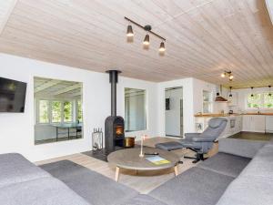 a living room with a couch and a table at 4 star holiday home in Gedsted-By Traum in Gedsted