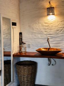 a bathroom with a bowl sink on a counter at Casa da Mata Corumbau in Corumbau +56 photos