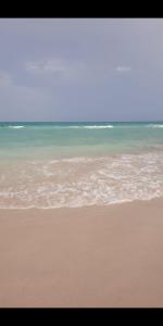 a beach with the ocean in the background at Dar Dhiafa Mayar -دار الضيافة ميار in Mahdia