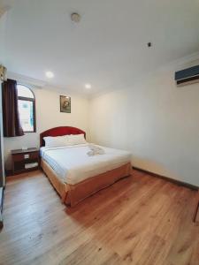 Postel nebo postele na pokoji v ubytování Sogo Hotel 2 + 8 fotografií