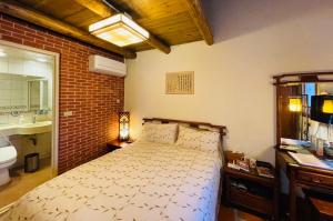 Postel nebo postele na pokoji v ubytování Grace Homestay