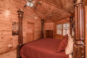a bedroom with a bed in a log cabin at Indoor Pool Beauty in Cosby +35 photos