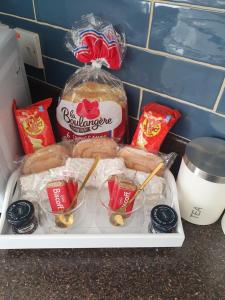a tray of food on a counter with some food at Cosy Modern 2 bed Garden view appartment, Parking, TV Wifi in Aberdeen +4 photos