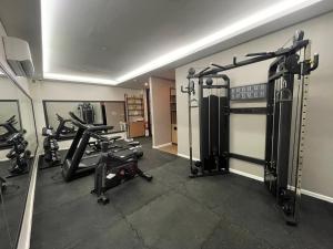 a gym with several treadmills and tread machines at Xen By Balai Norte in san juan la union
