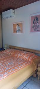 Postel nebo postele na pokoji v ubytování Kimmy Tahiti House + 18 fotografií