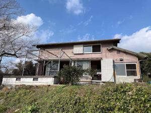 a brick house on top of a hill at Holiday house with great views! in Kariya +10 photos