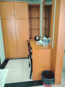 a kitchen with a counter with a phone on it at Fratini's Hotel Labuan in Labuan