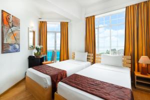 Voodi või voodid majutusasutuse Global Towers Hotel & Apartments toas