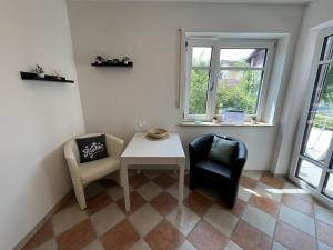 Posezení v ubytování Palmen Apartment direkt in Bad Aibling
