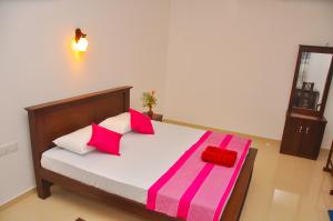 Postel nebo postele na pokoji v ubytování Hiru Resort Inn