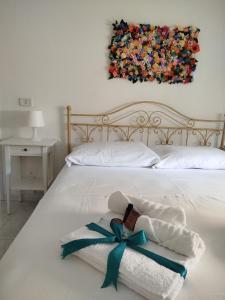 A bed or beds in a room at Casa Gioia