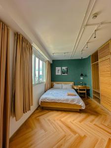 a bedroom with a bed and a desk at International Plaza, District 1 in Ho Chi Minh City
