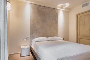 Postel nebo postele na pokoji v ubytování ASILO in BAROLO