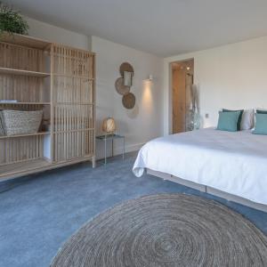 Postel nebo postele na pokoji v ubytování Op Oost Boutique hotel & Restaurant het Kook Atelier