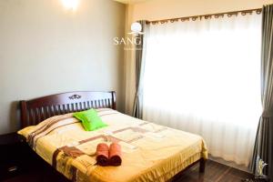 Letto o letti in una camera di Sangjun On Beach Resort
