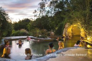 a group of people in the water in a hot tub at MALIBU House - BEACH & HOT SPRINGS - 16 guests in Capel Sound