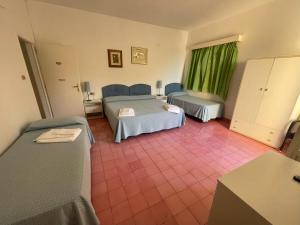 Postel nebo postele na pokoji v ubytování Hotel Villa Degli Aranci + 37 fotografií