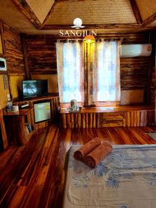 Letto o letti in una camera di Sangjun On Beach Resort