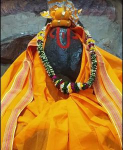 a person wearing a yellow dress and a hat at Hotel Jaipur In in Govardhan