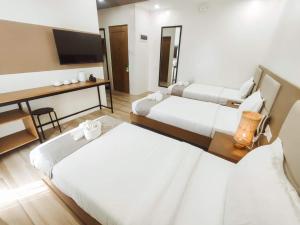 Postel nebo postele na pokoji v ubytování MDM Town Hotel
