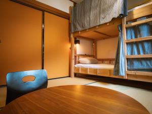 Postel nebo postele na pokoji v ubytování Next Chapter - Guesthouse - Kito