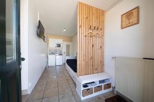 a small room with a bed in a room at Gevrey Wine Hôte in Gevrey-Chambertin