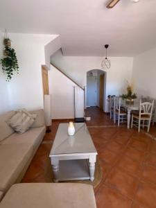 a living room with a couch and a table at Playa Antilla Golf in Lepe