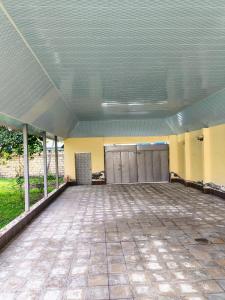 a large empty room with stalls in a building at Green Home in Gabala
