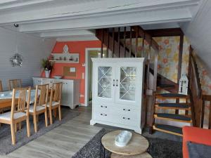 a kitchen and dining room with a staircase and a table at Hotel MOMA in Nagel +41 photos