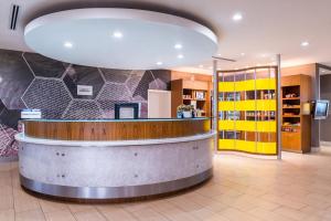 a lobby of a pharmacy with a large light fixture at SpringHill Suites Temecula Valley Wine Country in Temecula +32 photos