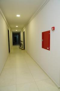 an empty hallway with a bike on the wall at Krtsanisi Grande apartment in Tbilisi City