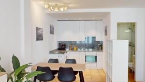 Kuchyň nebo kuchyňský kout v ubytování Zentral Altstadt Chur - Bahnhofsnah - Ferienwohnung - Bernina Express - Solution-Grischun
