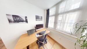 TV a/nebo společenská místnost v ubytování Zentral Altstadt Chur - Bahnhofsnah - Ferienwohnung - Bernina Express - Solution-Grischun