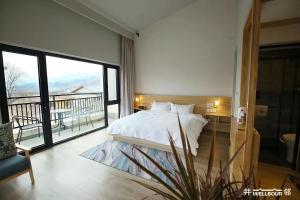 Fotografie z fotogalerie ubytování 井邻栗林花园民宿 v destinaci Chuaj-žou + 26 fotografií
