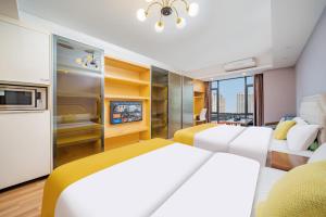 Letto o letti in una camera di 寓米公寓(琶洲会展中心广州塔店)