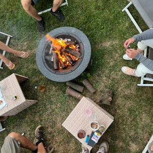 an overhead view of a grill with people sitting around it at VILLA am Paulsberg mit Sauna - V4 in Braunlage