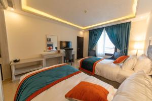 Rúm í herbergi á Petra Canyon Hotel