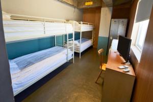 a room with a bunk bed and a desk at G Guesthouse Itaewon In Seoul in Seoul