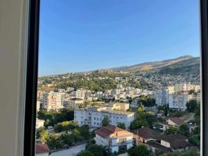 a view from a window of a city with buildings at Jonas Apartment in Gjirokastër +2 photos