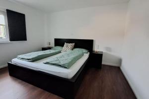 Postel nebo postele na pokoji v ubytování Ferienwohnung im Thüringer Wald