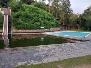 a swimming pool in the middle of a body of water at apartmán U dědy Lubina in Lultsch