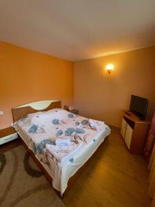 Ένα ή περισσότερα κρεβάτια σε δωμάτιο στο Cheia Sufletului +33 φωτογραφίες