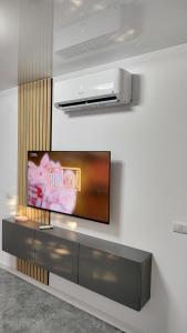 a flat screen tv sitting on a wall at Vegas luxury apartment in Constanţa
