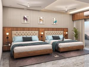 a bedroom with two beds and a wall at Prince Palace And Banquet in Pāndharkawada