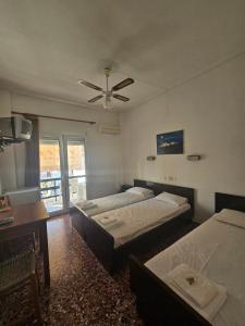 Postel nebo postele na pokoji v ubytování Dimitrouli rooms + 10 fotografií